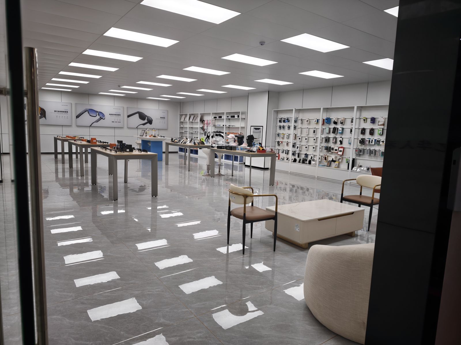 Product showroom displaying smart glasses and power bank samples at YHR Technology